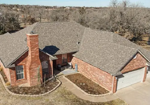 The top of a home with newly installed Malarkey Shingles, thanks to Denny Zimmerman Roofing