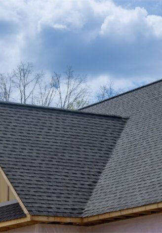 The top of a new house with asphalt shingles, thanks to Denny Zimmerman and his services for Residential Roofing in Central Illinois