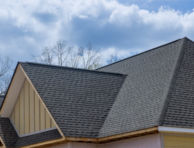 The top of a new house with asphalt shingles, thanks to Denny Zimmerman and his services for Residential Roofing in Central Illinois
