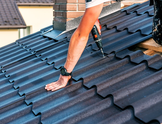 Denny Zimmerman contractor installing new metal roofing in Central Illinois